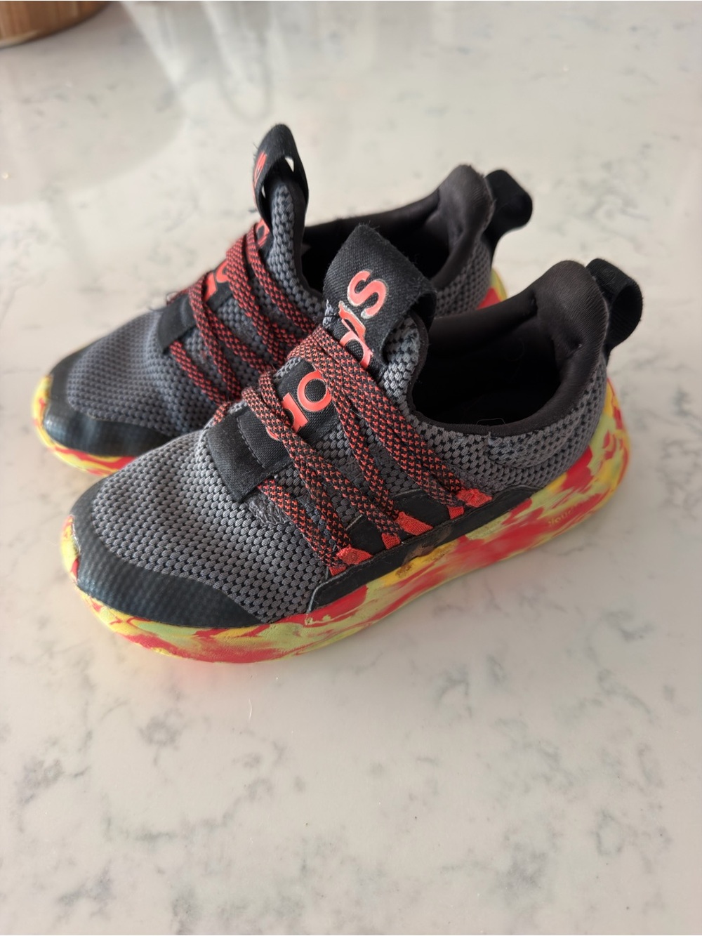 adidas Kids Gray Sneaker with Red Accents and Yellow-Red Marbled Sole
